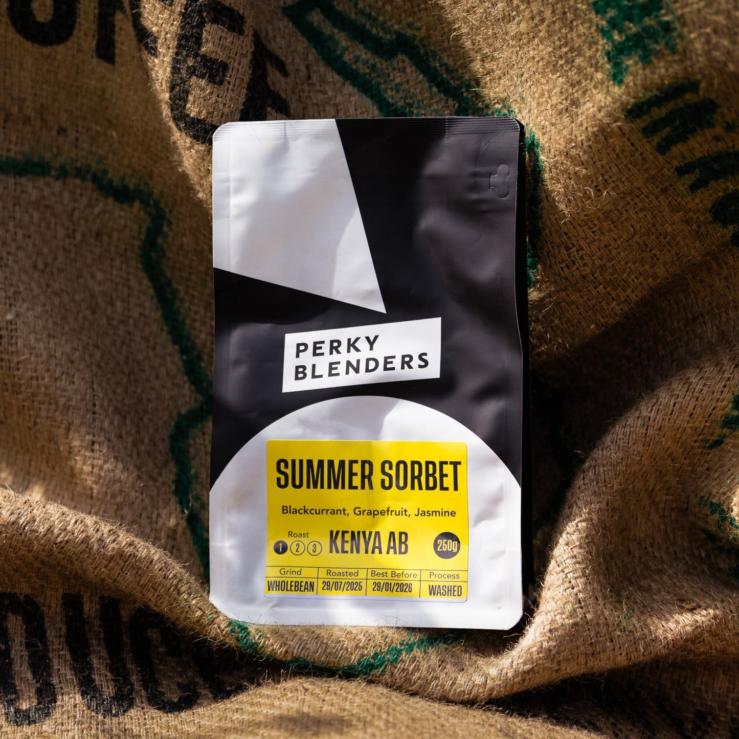 Perky Blenders Summer Sorbet coffee package on a burlap background