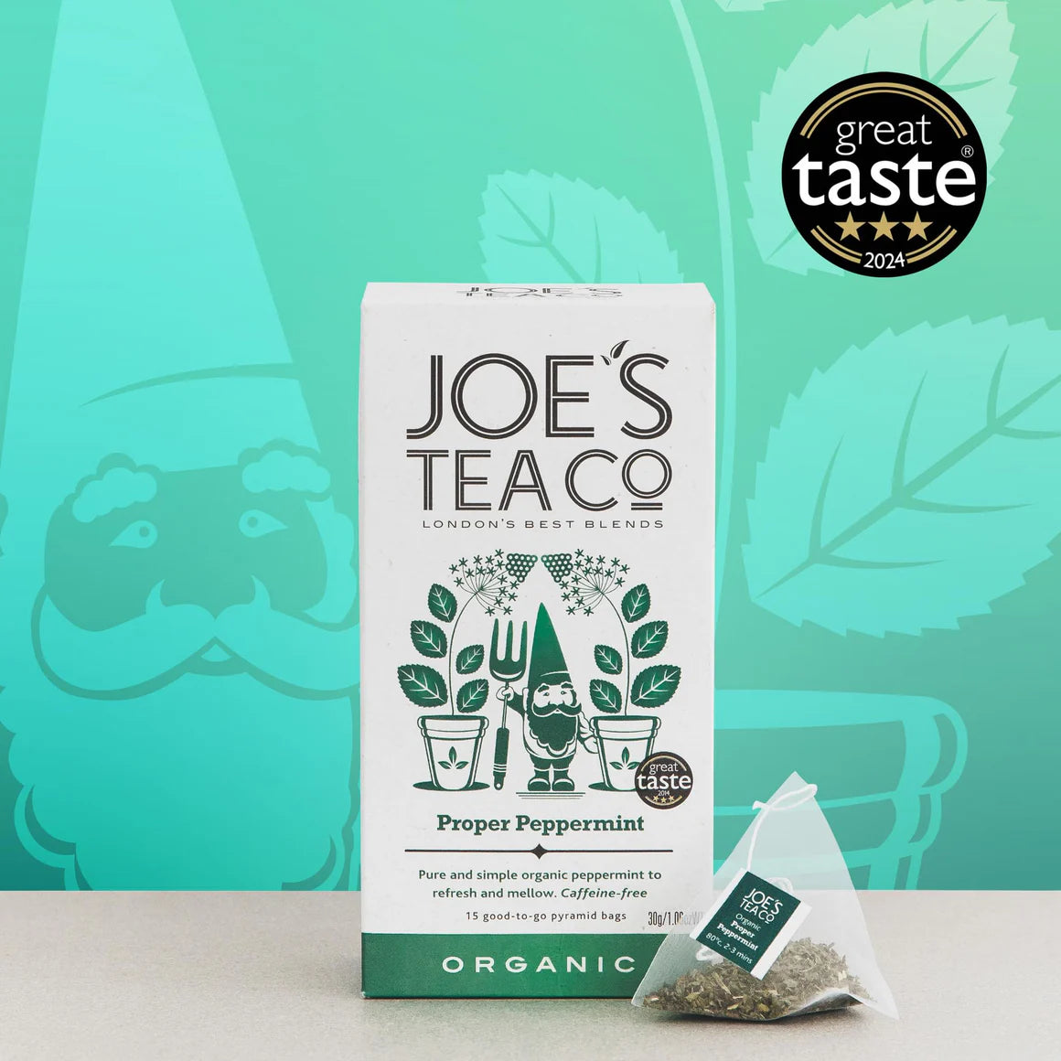 Packaging of Joe's Tea Proper Peppermint with a tea bag in front, indicating organic quality with a green and white color scheme.